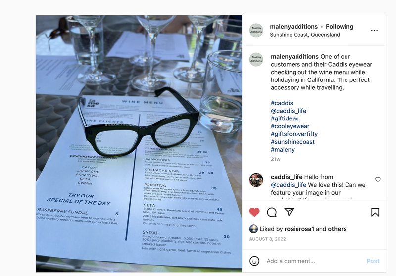 A pair of Cadis eyewear sitting on a wine menu showcasing a Maleny Additions customer travelling to the USA